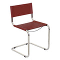 Fauteuils cantilever à structure chromée (disponibles en plusieurs coloris de similicuir).